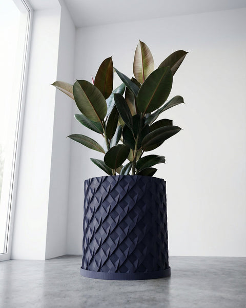 A navy blue planter pot with a green plant on a wooden table with green legs.