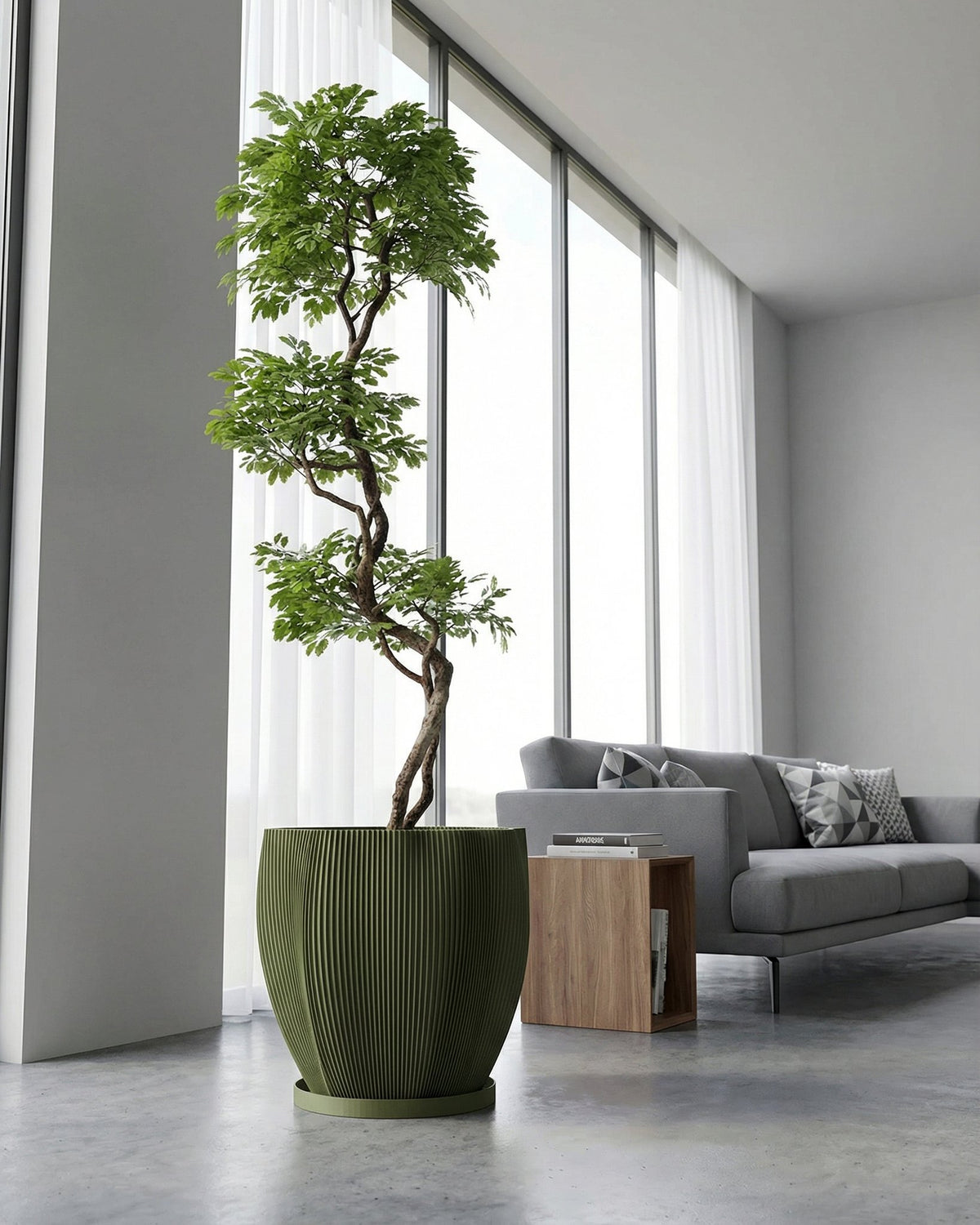A green planter pot with a houseplant sitting on a windowsill.