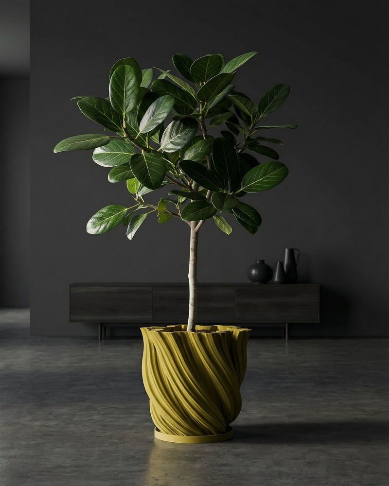 A yellow planter pot with a green and pink plant sits on a dark wood table in a room with olive green walls.