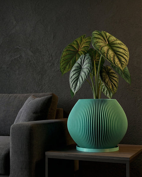 A vibrant green planter pot sits atop a wooden cabinet, overflowing with lush, trailing greenery. The pot's ridged texture contrasts with the smooth surface of the cabinet, creating a visually appealing focal point in the room.