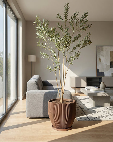 A variegated plant in a brown textured planter pot sits on a wooden cabinet against a mustard-colored wall.