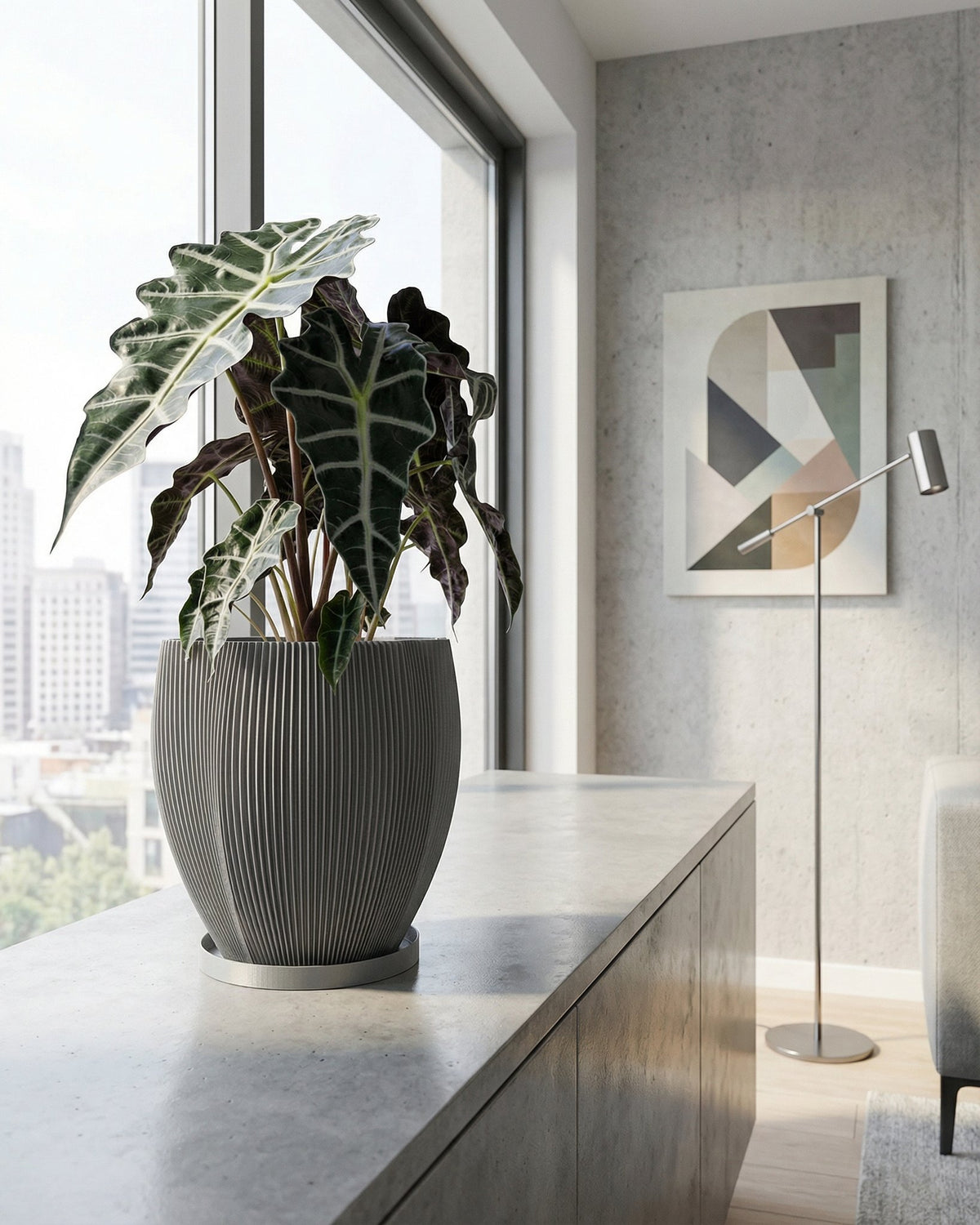 A gray planter pot with a green ivy plant sits on a wooden shelf against a rust-colored wall.