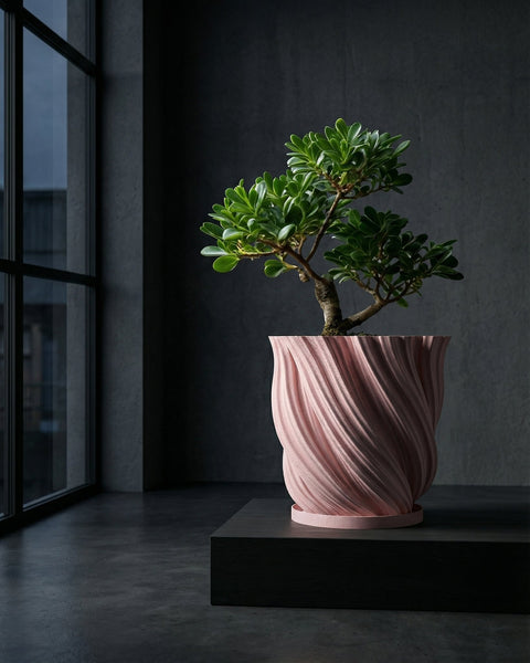 A pink planter pot with a rubber plant sits on a wooden cabinet in a green entryway with a round mirror on the wall.