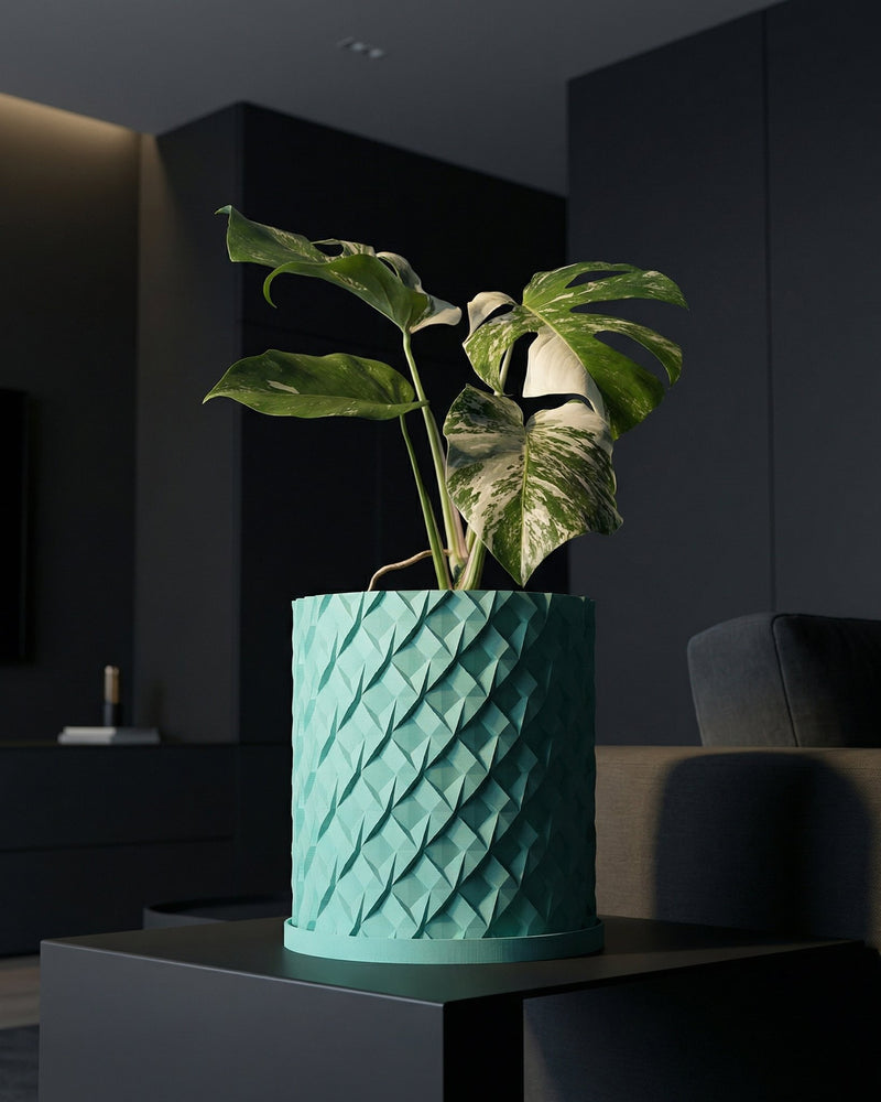 A light blue planter with a woven texture, holding a lush green plant with round leaves, sits on a wooden side table next to a couch.