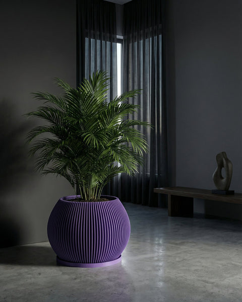 A vibrant purple planter pot with a lush green plant inside, set against a modern, minimalist backdrop.
